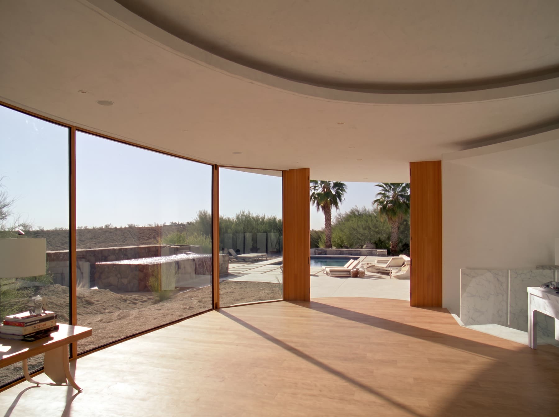 Sunlight pouring through spotless floor to ceiling windows after Curb Appeal cleaned the exterior glass